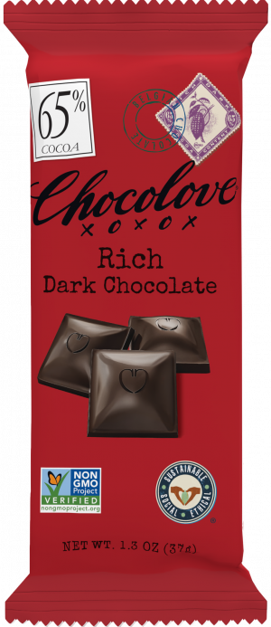 A Chocolove Peppermint in Dark Chocolate mini bar is sealed in its light blue packaging. The wrapper showcases elegant black script branding and an image of fresh, vibrant peppermint leaves, emphasizing its refreshing flavor. A 55% cocoa label is positioned in the top left corner, alongside a blue Belgian Chocolate stamp and a vintage-style postage illustration of peppermint near the top. Certification logos for Non-GMO and Rainforest Alliance appear at the bottom.