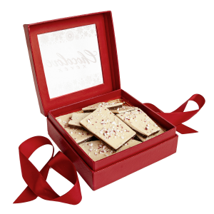 Chocolove Peppermint Bark Gift Box featuring layers of white and dark chocolate topped with crushed peppermint candy. Presented in an elegant red gift box with ribbon, perfect for holiday gifting and festive celebrations.