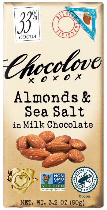 Chocolove Almonds & Sea Salt in Milk Chocolate bar. The wrapper features a 33% cocoa content, with a Belgian chocolate stamp and a small image of almonds and sea salt. The packaging also includes the Non-GMO Project Verified label, the Rainforest Alliance certification, and a gold heart-shaped seal. The bar's name is written in bold, black lettering on a cream-colored background, with almonds and a sprinkling of sea salt depicted at the bottom. Net weight of 3.2 oz (90g).