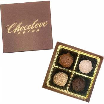 Top of Chocolove box and 4 truffles in the open box